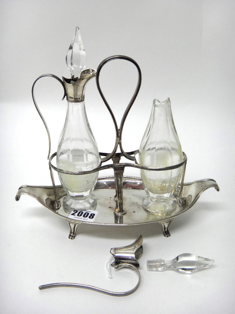 Appraisal: A George III silver twin bottle oil and vinegar condiment