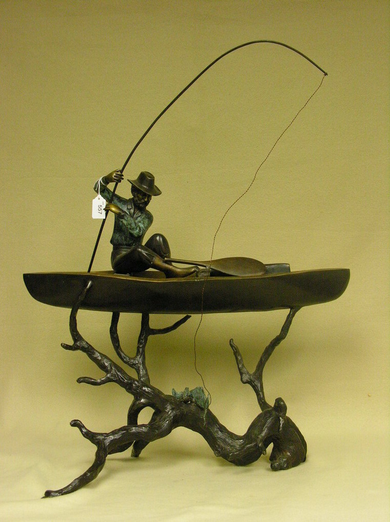 Appraisal: BRONZE MAN FISHING IN A BOAT Age unknown Size to