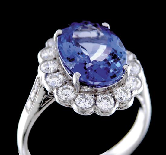 Appraisal: Tanzanite and diamond ring oval tanzanite ct surrounded by round