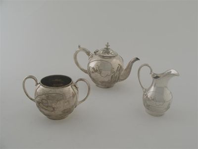 Appraisal: A Victorian plated three piece bachelor's teaset decorated with a