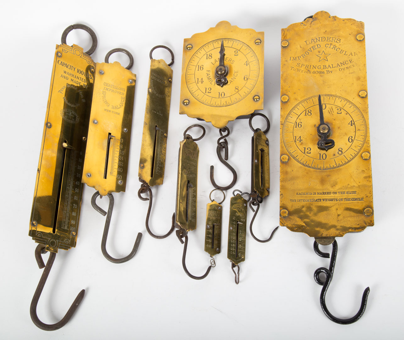 Appraisal: Nine brass and sheet iron hanging spring scales th century