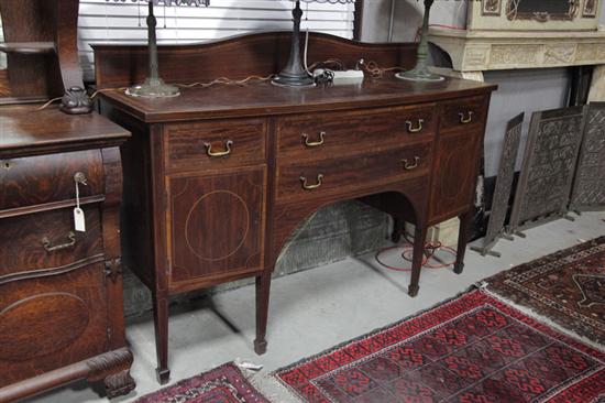 Appraisal: HEPPLEWHITE STYLE SIDEBOARD Mahogany having a shaped gallery crossbanded top