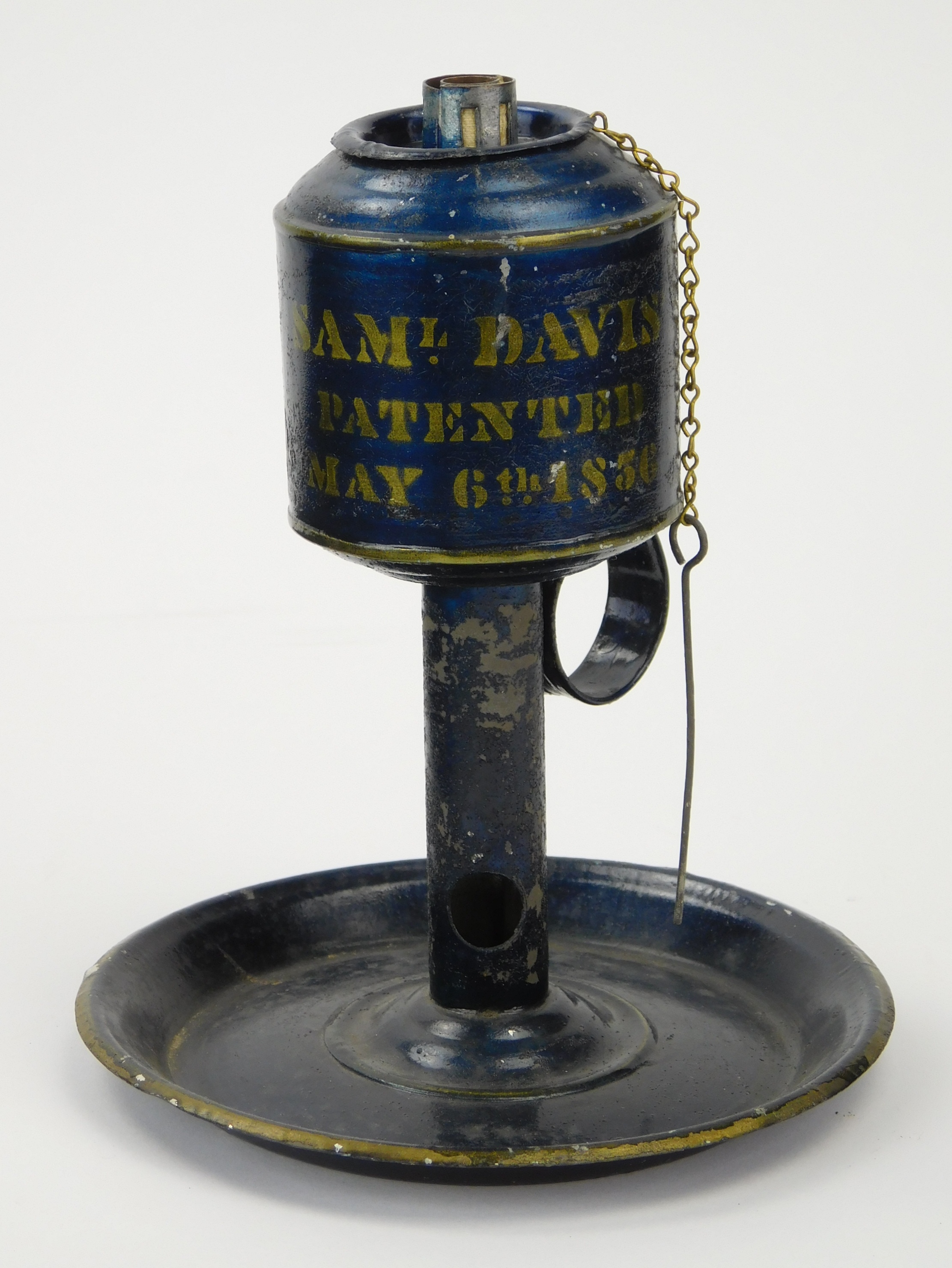 Appraisal: Tinware oil lamp blue black japanning stenciled in gold lettering-'