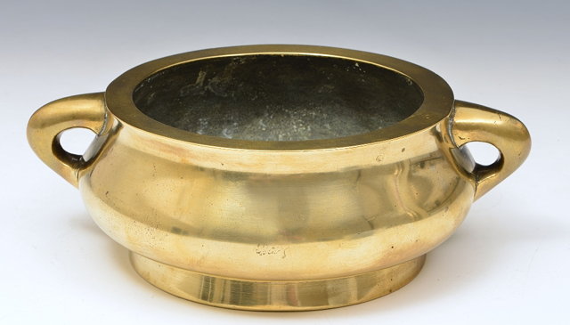 Appraisal: A CHINESE BRONZE TWO HANDLED CENSER of plain form with