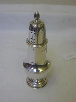 Appraisal: AN EDWARDIAN CASTER of pear form with flame finial on