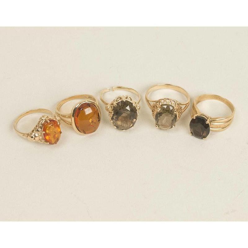 Appraisal: Assorted Amber Smoky Quartz Rings Five rings comprising an amber