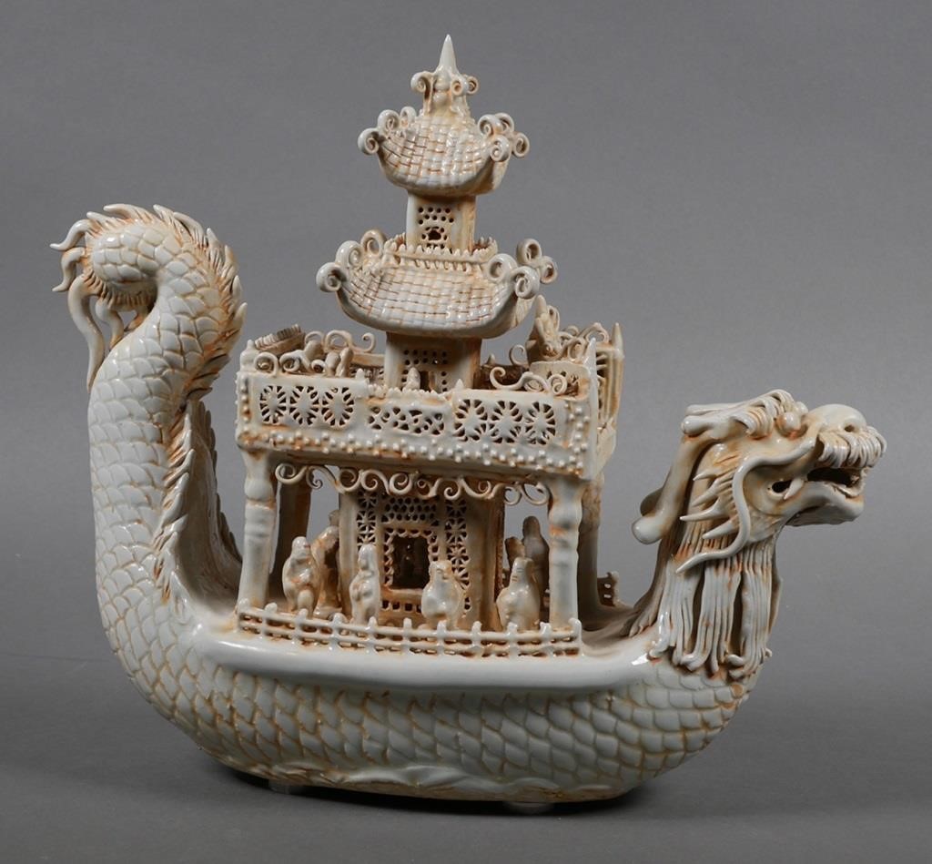 Appraisal: Chinese porcelain dragon boat with pagoda figurine Ceramic vessel in