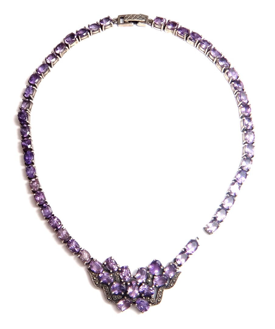 Appraisal: An amethyst and marcasite set collar necklace claw set with