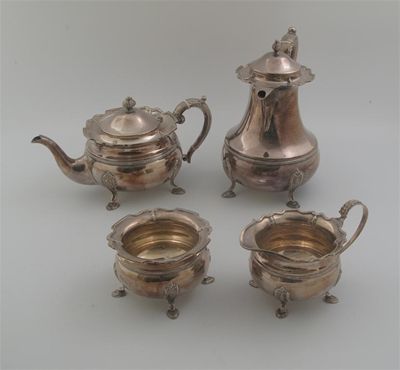 Appraisal: A modern four-piece tea service with circular bodies on four