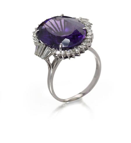 Appraisal: An amethyst and diamond set cocktail ring the central claw