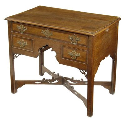 Appraisal: A George III lowboy with mahogany crossbanding fitted one long