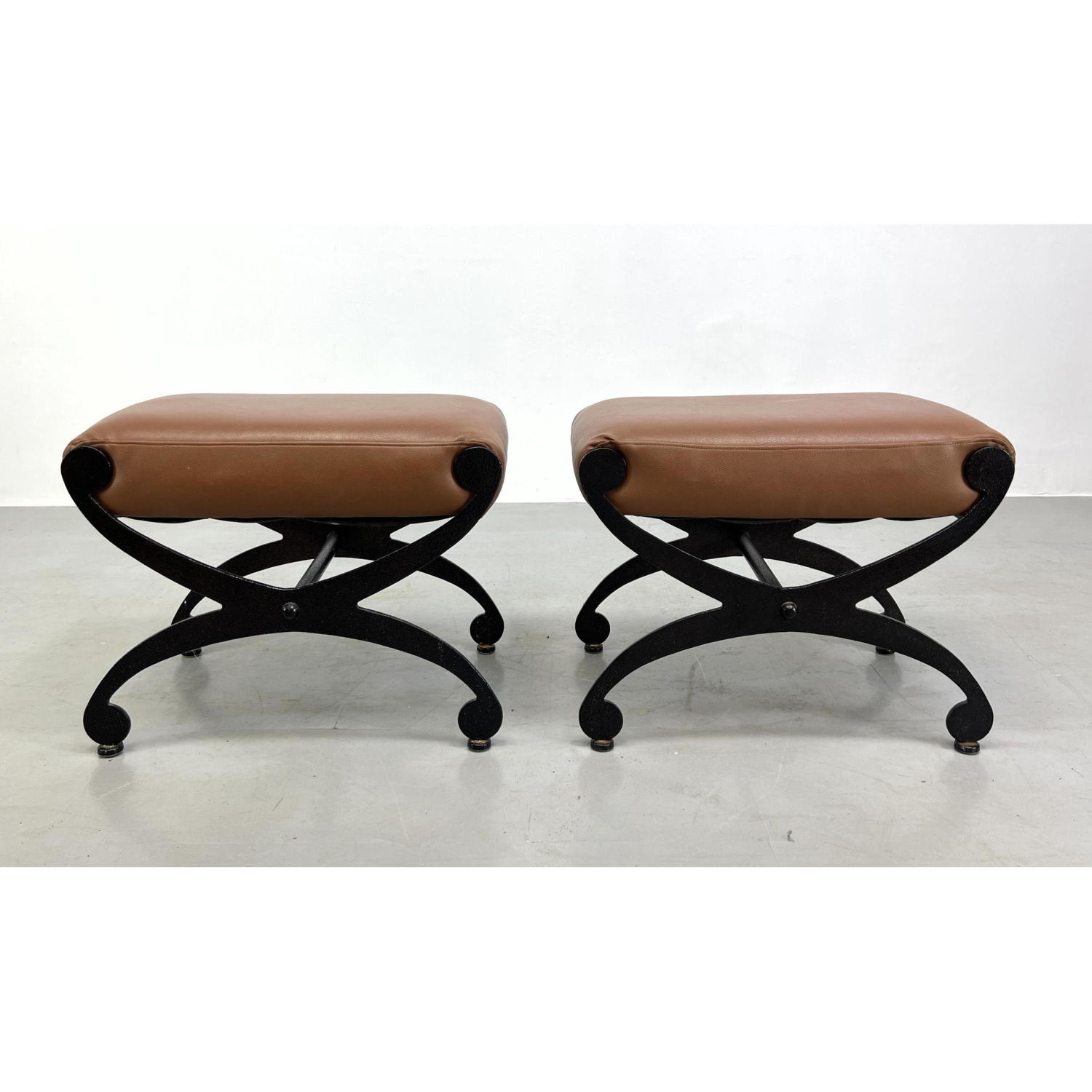 Appraisal: Pair Decorator Iron X base stools with brown vinyl tops