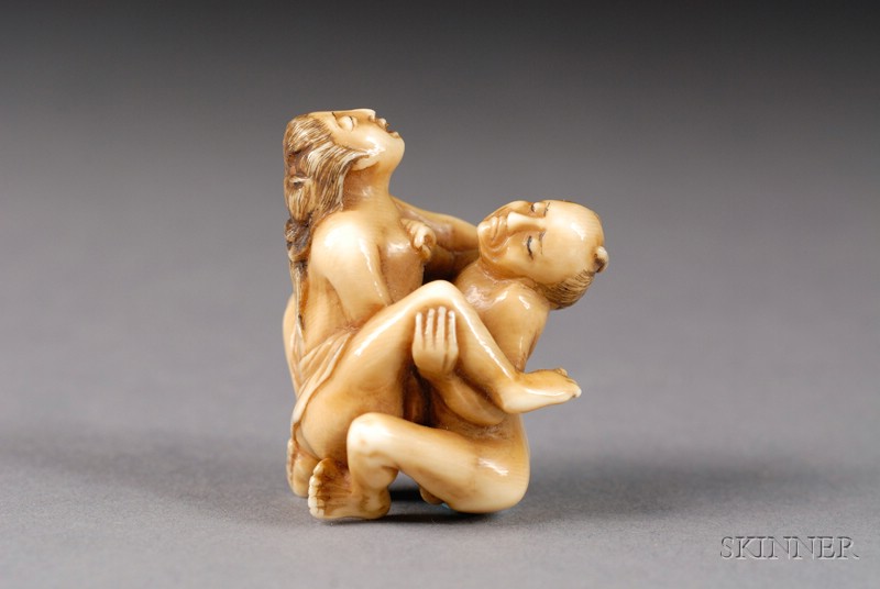 Appraisal: Ivory Netsuke th century erotic scene of a man and