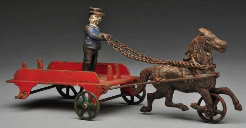 Appraisal: Cast Iron Wilkins Depot Wagon Horse-Drawn Toy Description American Comes