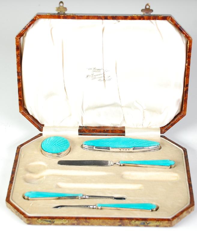 Appraisal: GEORGE V CASED FIVE PIECE SILVER AND TURQUOISE GUILLOCHE ENAMELLED