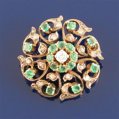 Appraisal: A Victorian circular emerald and diamond brooch set in silver