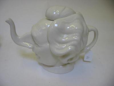 Appraisal: A LUCK AND FLAW POTTERY TEAPOT modelled as a caricature