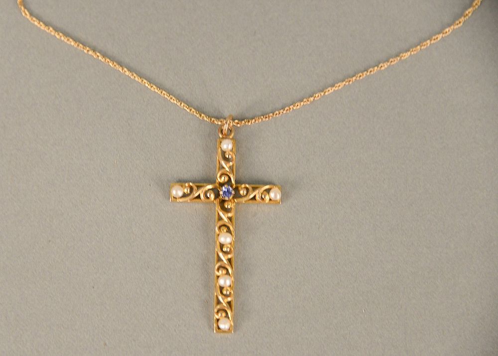 Appraisal: karat gold cross and chain set with one blue stone