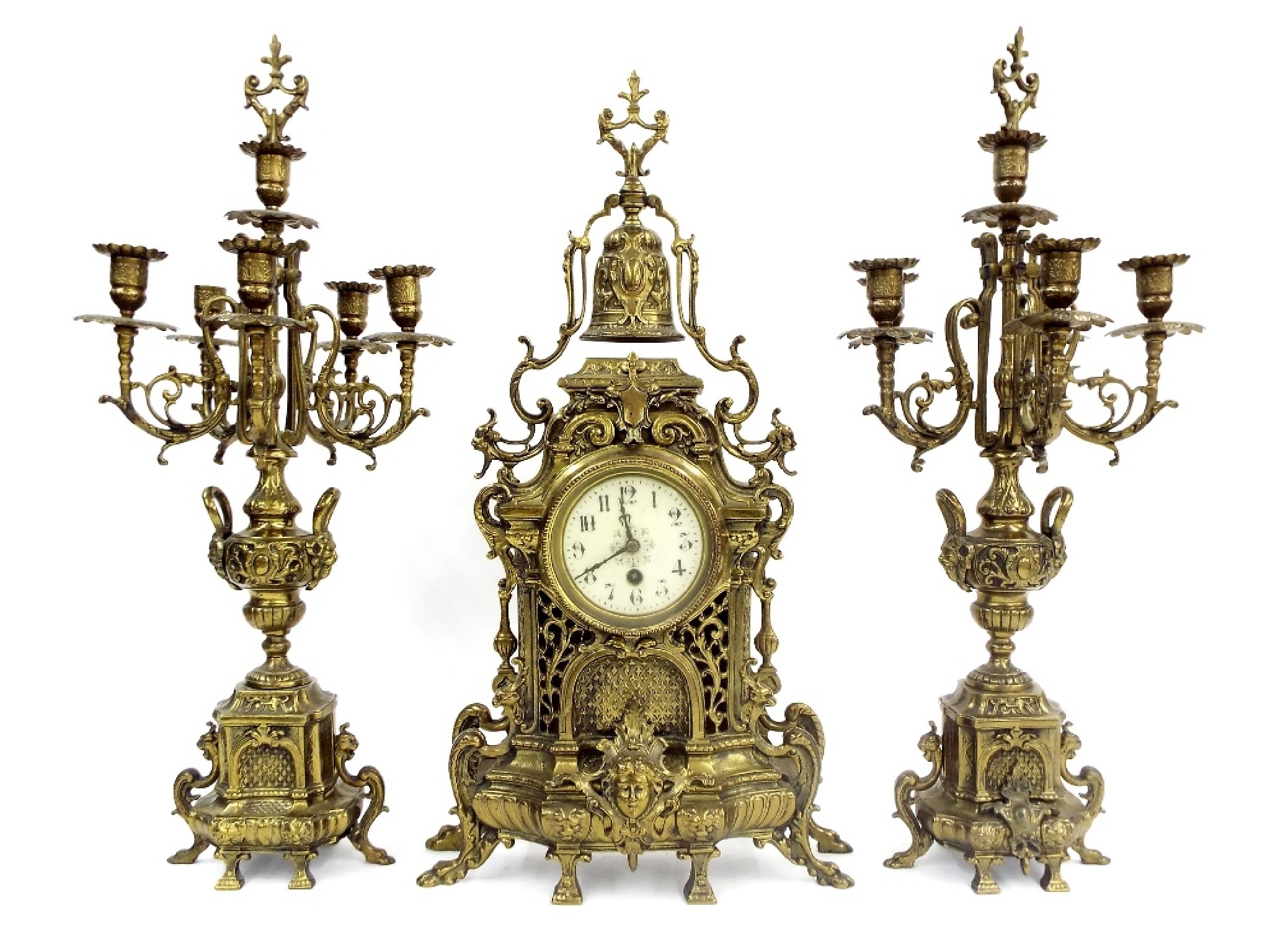 Appraisal: French gilt cast metal architectural clock garniture comprising a clock