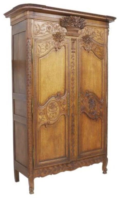 Appraisal: French Provincial oak wedding armoire th c carved egg and