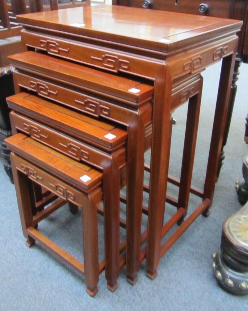 Appraisal: A th century Chinese nest of four hardwood tables with