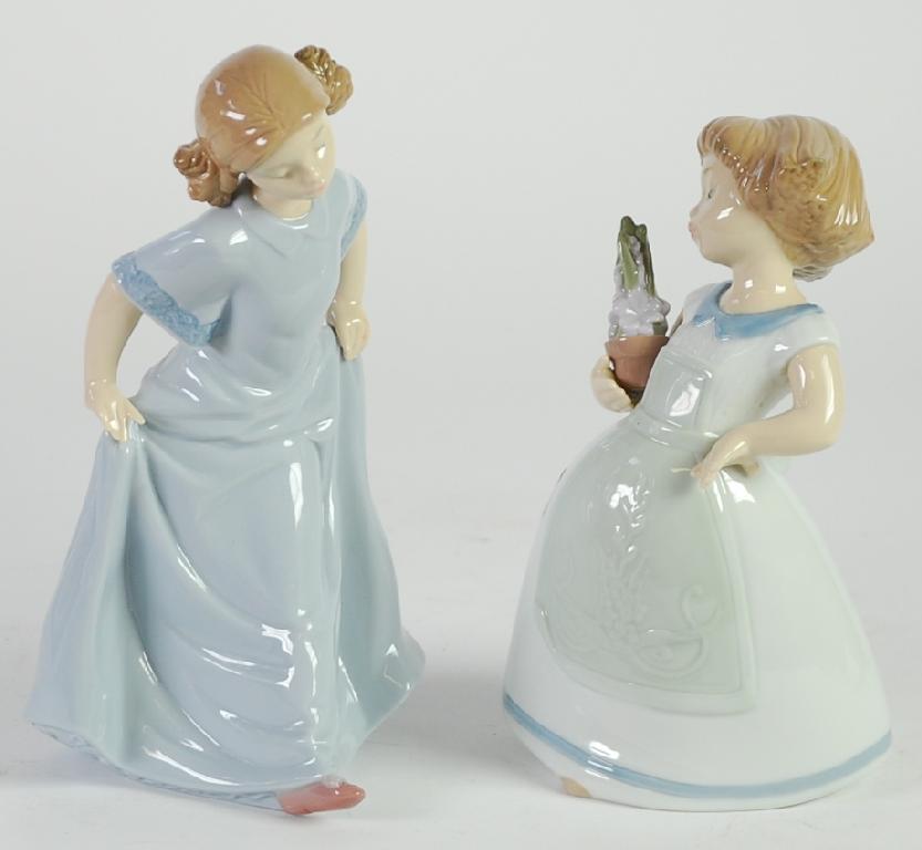 Appraisal: TWO NAO SPANISH PORCELAIN FIGURES OF YOUNG GIRLS ONE MODELLED