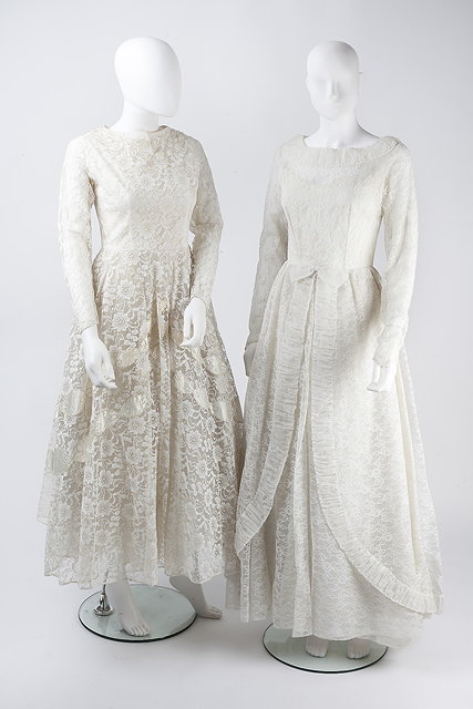 Appraisal: Two late s cream lace wedding dresses the first with