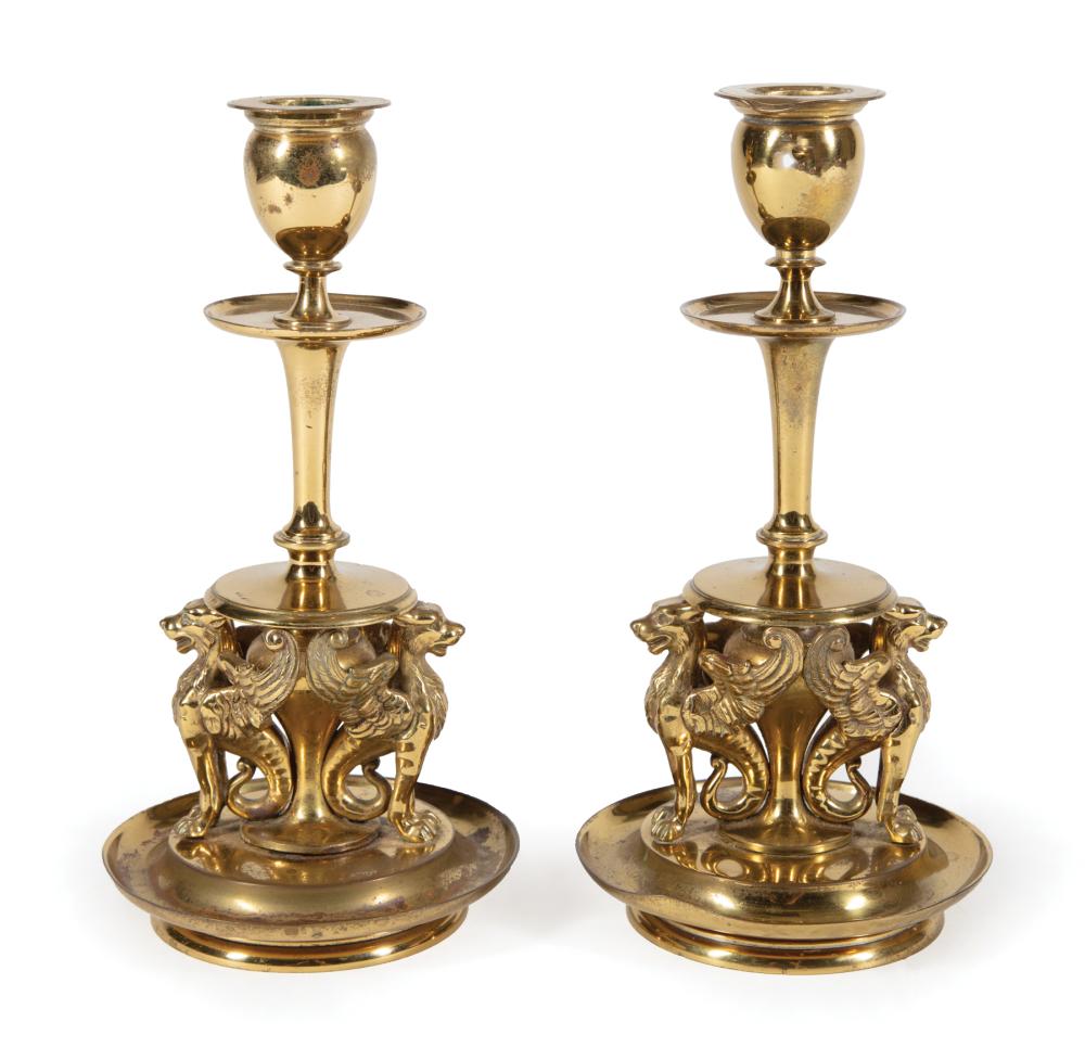 Appraisal: Two Brass Candlesticks dish base with griffins h in dia