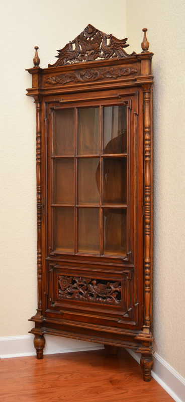 Appraisal: CARVED VICTORIAN CORNER CABINET Pierced carved pediment with bird and