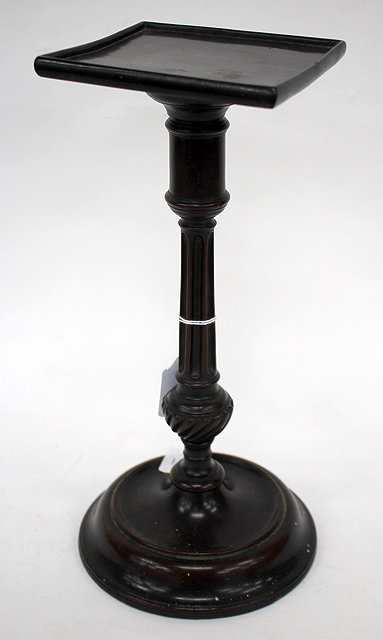 Appraisal: A GEORGE III MAHOGANY TAPER STICK STAND with a square