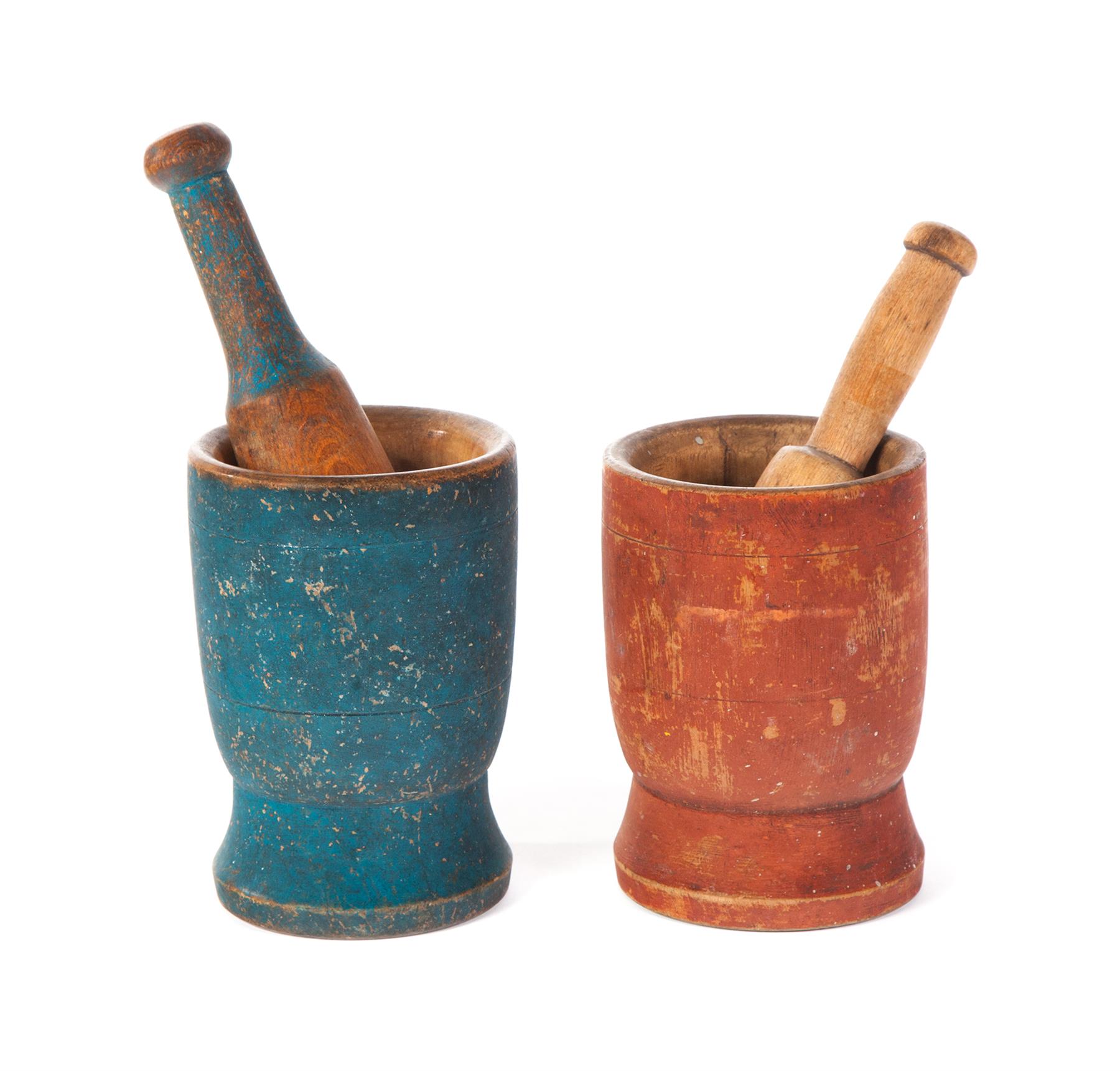 Appraisal: TWO PRIMITIVE PAINTED MORTARS AND PESTLES American nd half- th