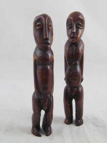 Appraisal: A pair of African carved ivory figures cm high