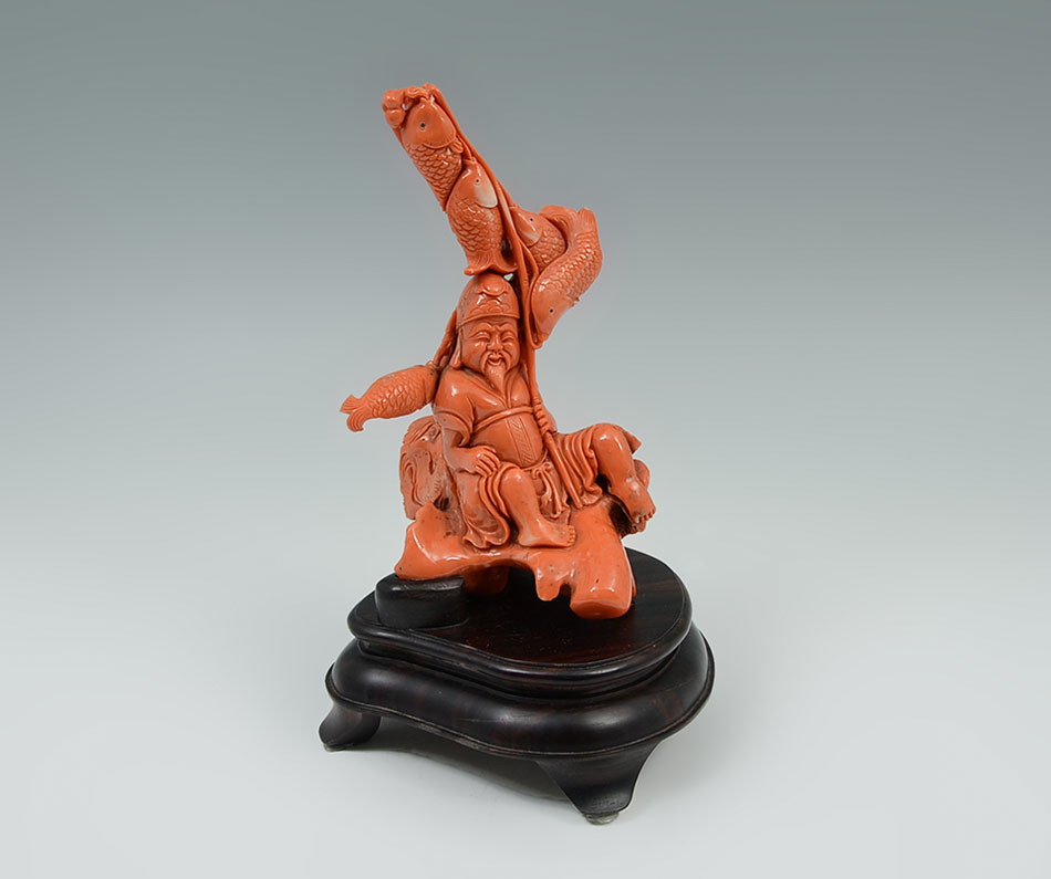 Appraisal: CARVED CORAL FIGURE OF EBISU WITH FISH Figure of Ebisu