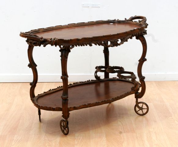 Appraisal: An Edwardian carved drinks trolley x x cm