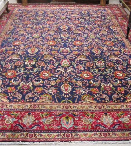 Appraisal: PERSIAN TABRIZ CARPET overall floral design on royal blue ground