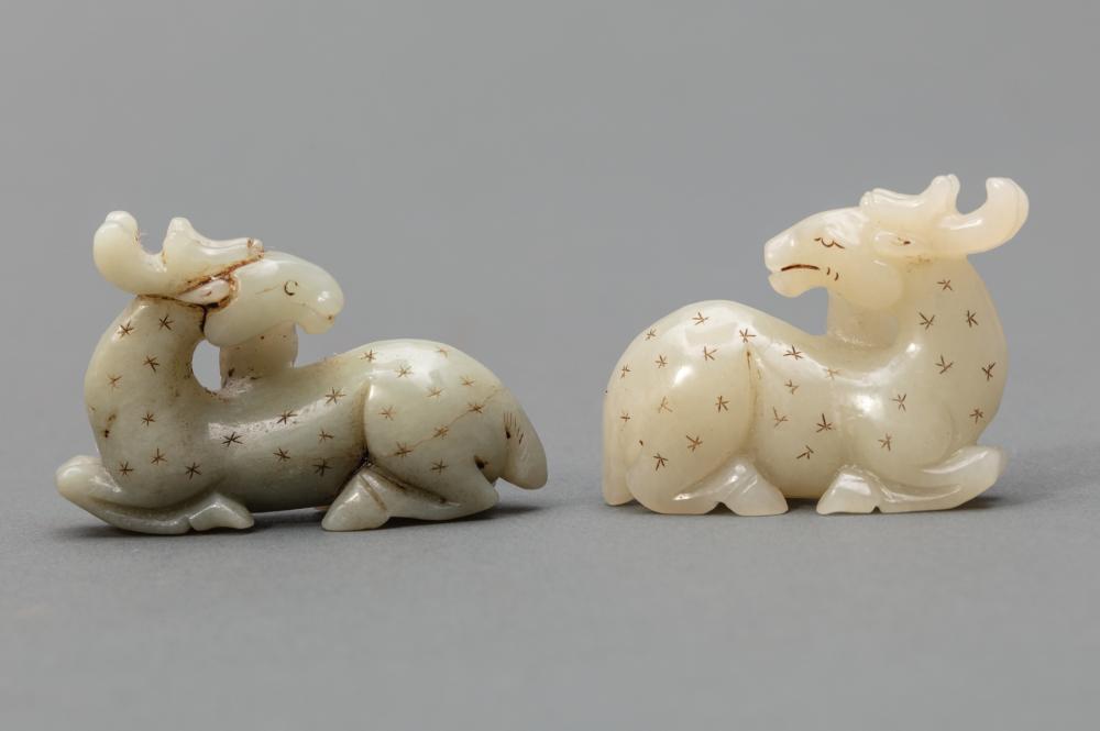 Appraisal: Two Chinese Celadon Jade Recumbent Spotted Deer carved in mirror