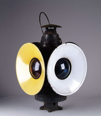 Appraisal: RAILROAD LANTERN Nice four lens railroad lantern has black steel