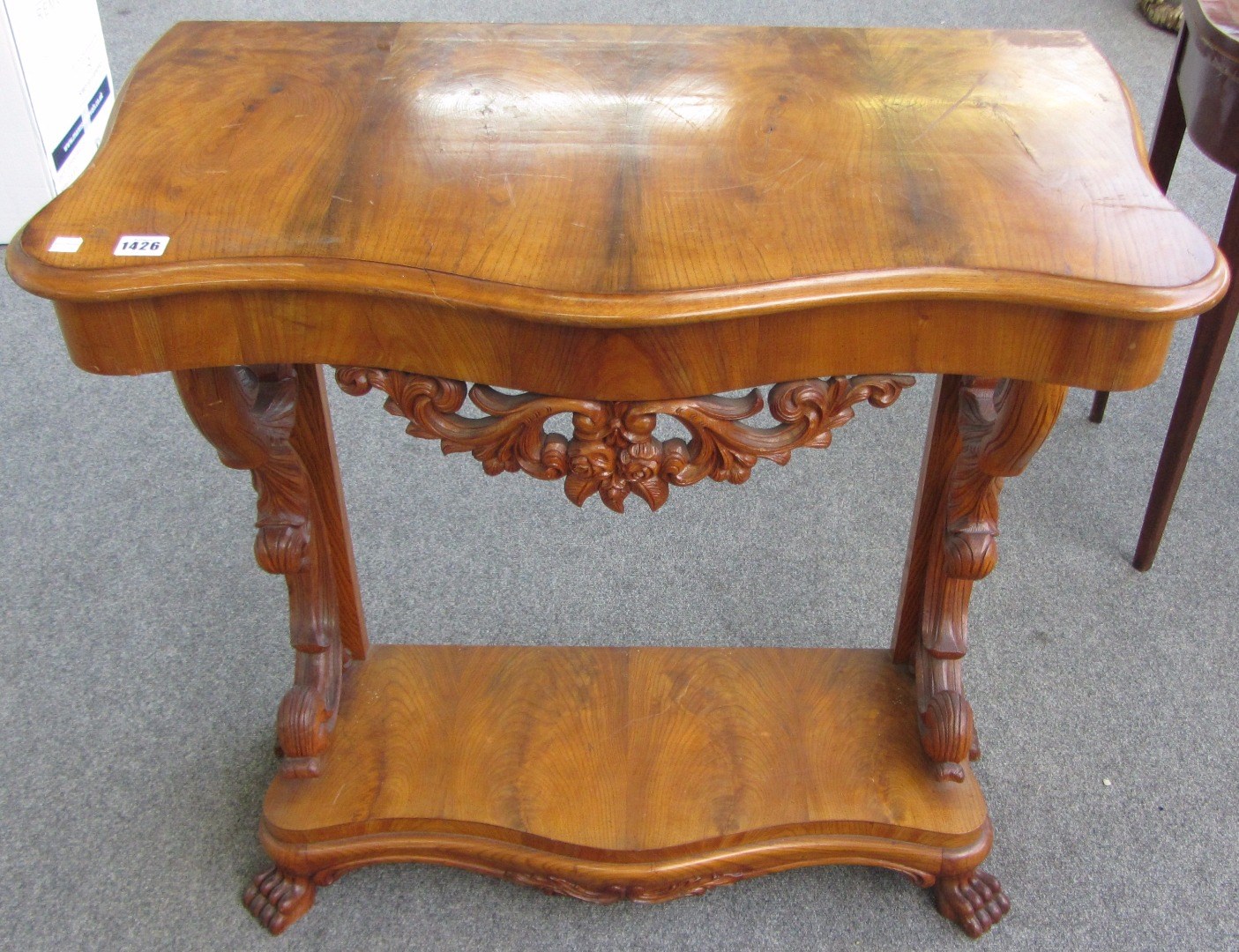 Appraisal: A th century Continental walnut serpentine console table on scroll