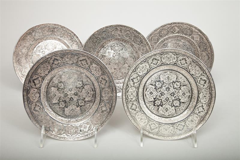 Appraisal: Five Near Eastern Silver-Plated Coasters With impressed Arabic mark and