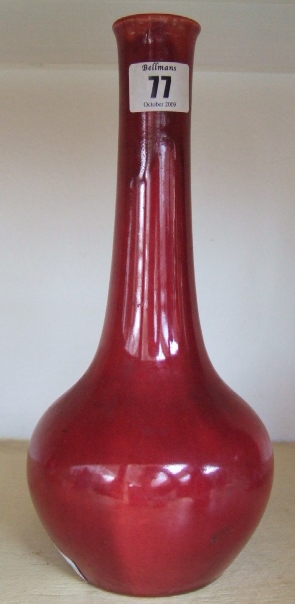 Appraisal: A Burmantofts red ground bottle neck vase cm