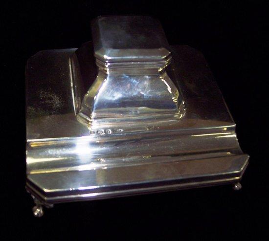 Appraisal: An inkstand and pen tray of canted square shape raised