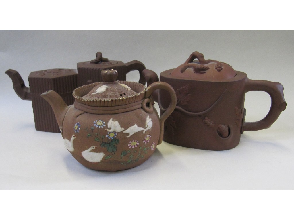 Appraisal: Chinese teracotta double teapot and two other Chinese teapots