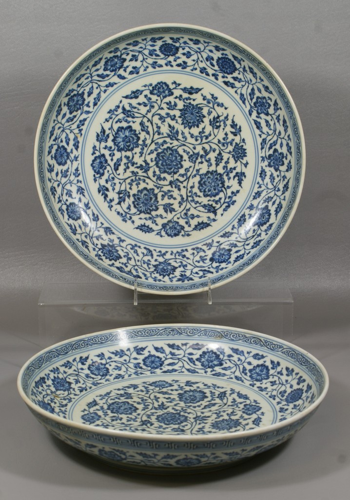 Appraisal: Pr Chinese porcelain shallow bowls with blue floral decoration reign