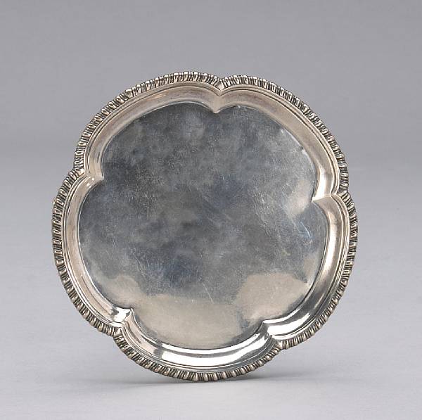 Appraisal: A George III silver pentafoil tripod salver with gadroon rimJohn