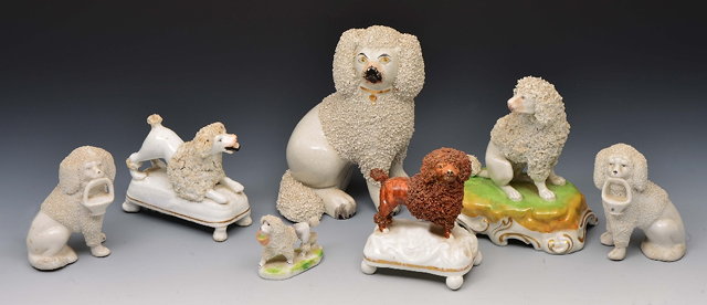 Appraisal: Pair of Dresden model of seated poodles cm high and