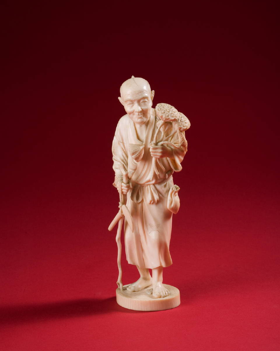 Appraisal: JAPANESE CARVED IVORY FIGURE OF AN ELDERLY MAN HOLDING FLOWERS