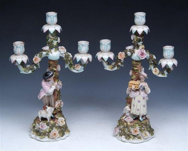 Appraisal: A PAIR OF TH CENTURY CONTINENTAL PORCELAIN THREE BRANCH CANDLESTICKS