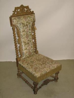 Appraisal: A VICTORIAN BLEACHED WALNUT NURSING CHAIR of Jacobean design the