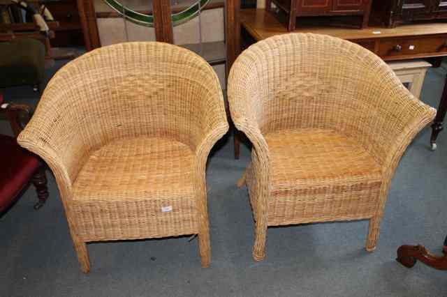 Appraisal: A SET OF THREE WICKER CONSERVATORY ARMCHAIRS together with matching