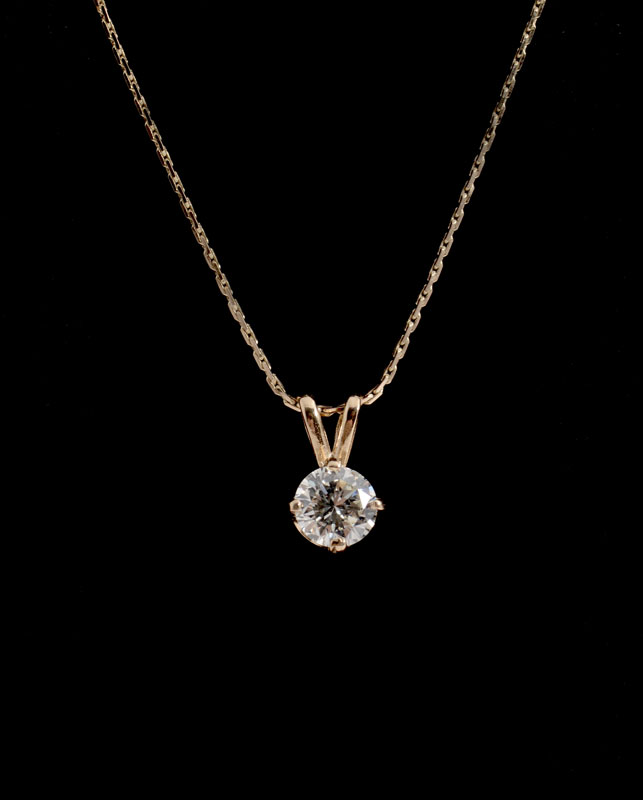 Appraisal: CT SOLITAIRE DIAMOND PENDANT ON K CHAIN Round brilliant cut